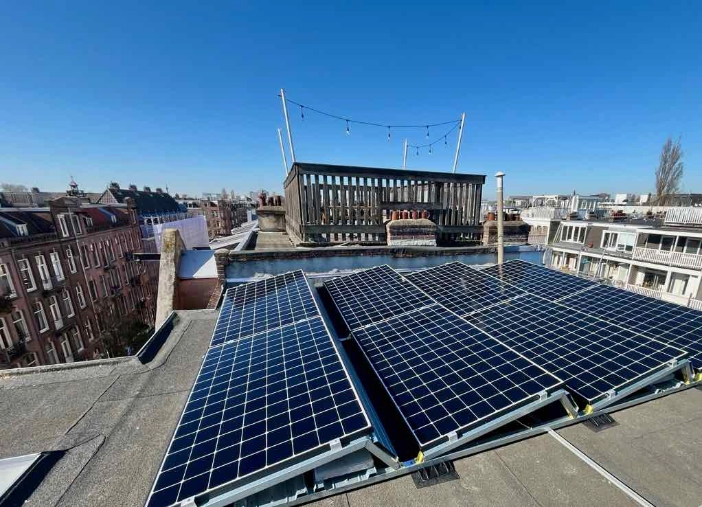 New solar panels underneath a clear blue sky