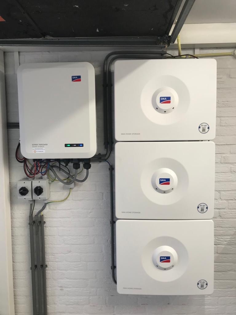 An SMA Sunny Tripower Smart Energy hybrid inverter with three SMA Home Storage batteries, totaling about 10 kWh of battery storage